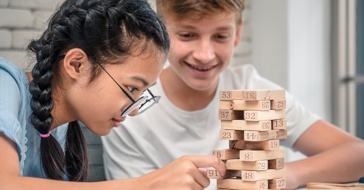 Gameschooling: Teens playing Jenga